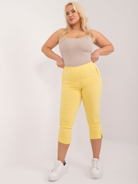 Jasnożółte dopasowane spodnie 3/4 plus size Jasnożółte dopasowane spodnie 3/4 plus size