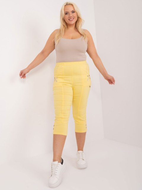 Żółte spodnie 3/4 plus size z materiału Żółte spodnie 3/4 plus size z materiału